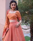 THE AZMAT CORAL LEHNGA