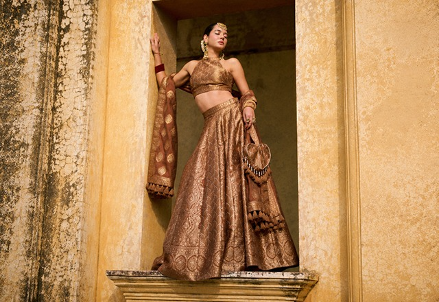 Women wearing elegant Indian ethnic outfits as wedding guest